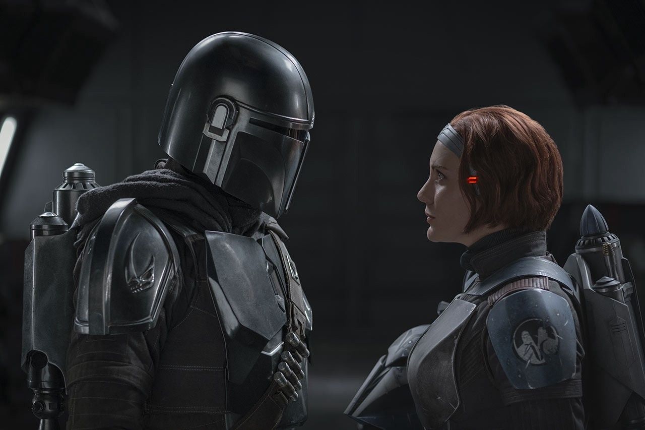 Pedro Pascal as Din Djarin, and Katee Sackhoff as Bo-Katan Kryze